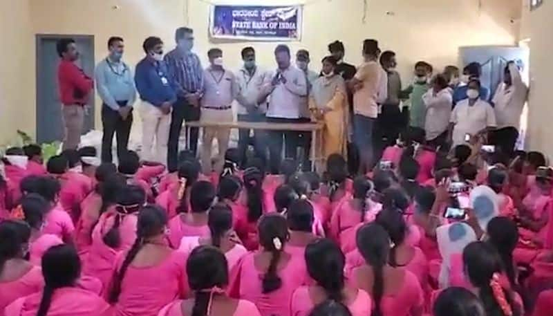 Karnataka MLA distributes ration kits to ASHA workers paying no heed to social distancing norms