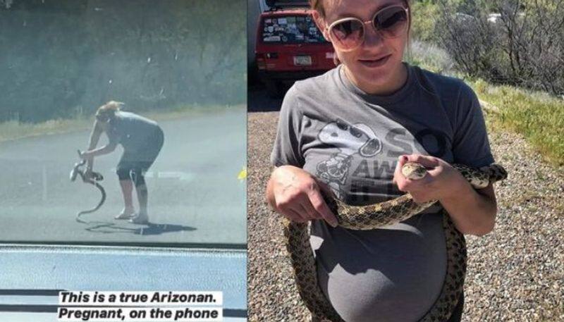 Pregnant woman runs in the middle of road to rescue snake