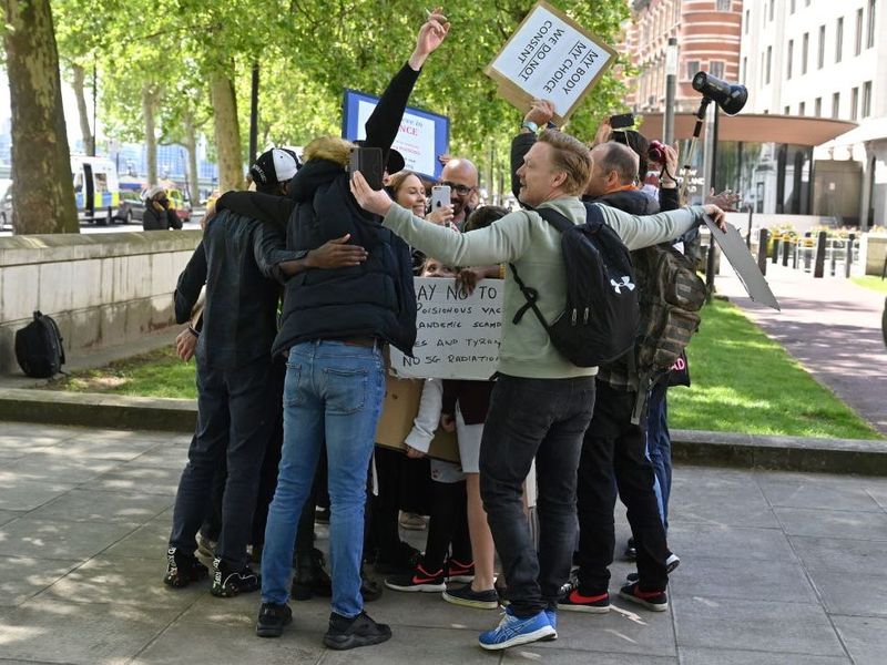 Protesters take part in group hug to defy lockdown in London