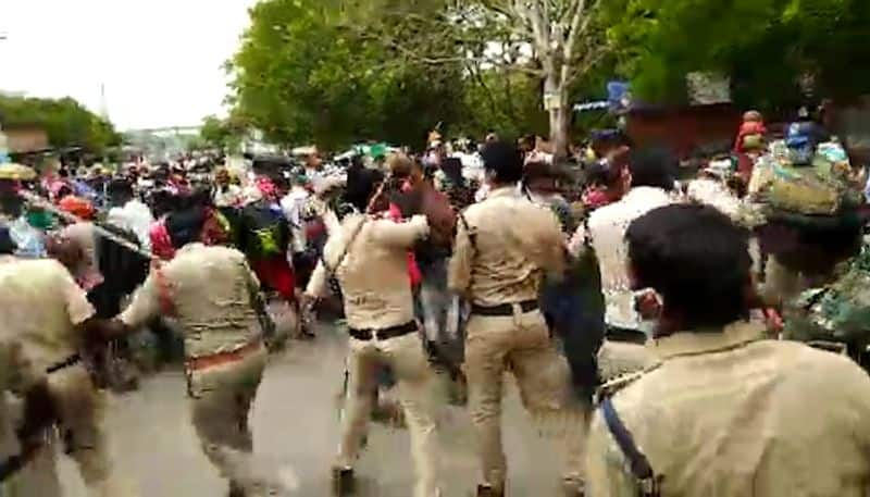 Hundred migrant workers hit the streets, pelt stones at police to return home