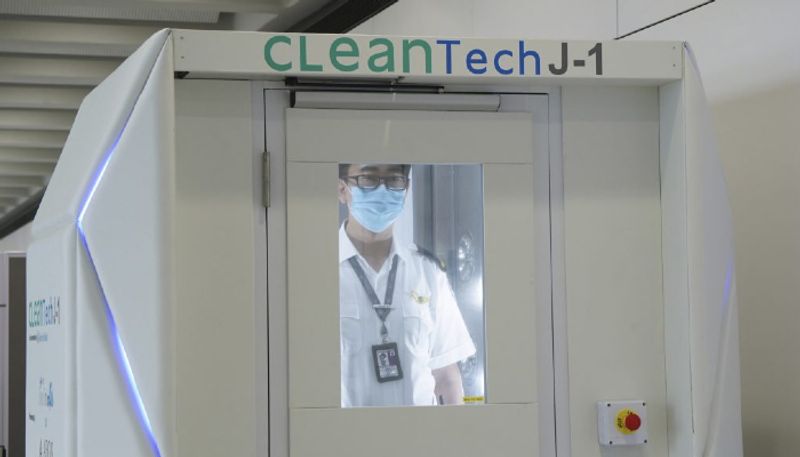 Coronavirus Hong Kong airport trials full-body disinfection booth deploys cleaning robots fight COVID-19