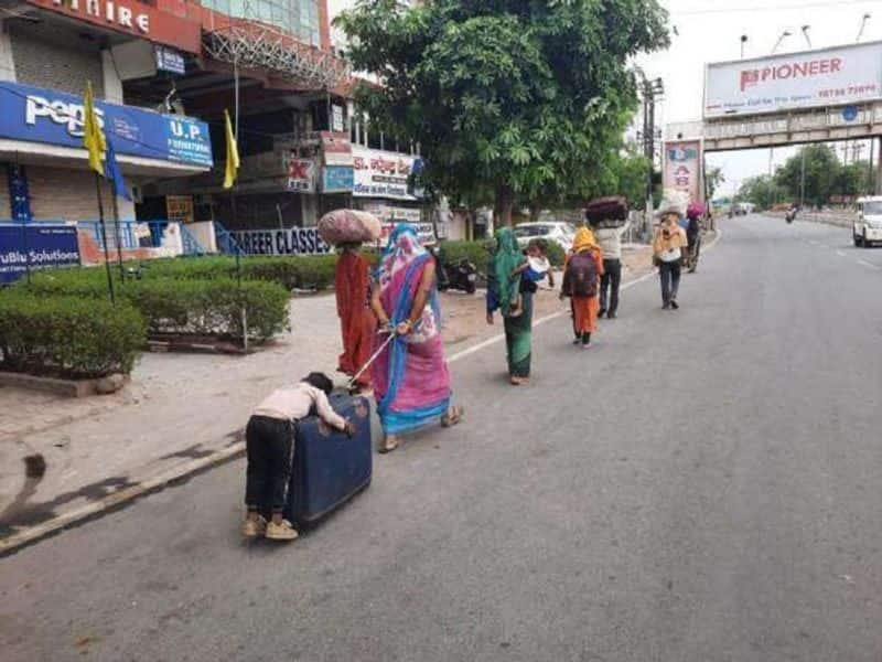 Boy Sleeps On Suitcase Wheeled By Mother: Video Tells Migrants' Plight in India during the Lockdown