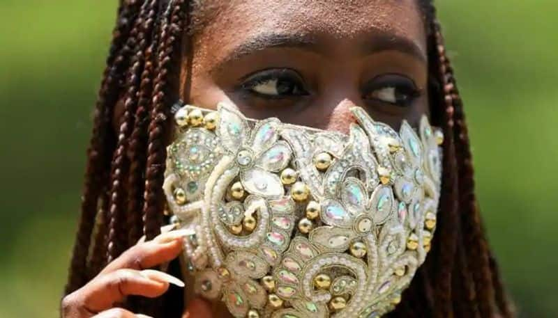 nigerian fashion stylist wears designer mask to set a model amid coronavirus outbreak