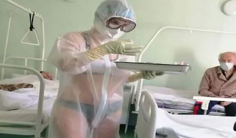 Russian Coronavirus Nurse Scolded for Wearing Bikini Under See-Through Gown