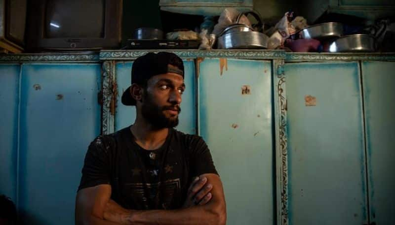 here the photos Egyptian  soccer Player Turns Into a Street Vendor