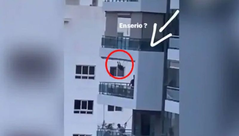 viral video in which a man pushing child on 8th floor balcony swing