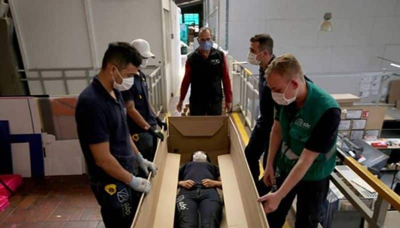 Covid 19 death rate increases business man produces a bed that can convert as coffin