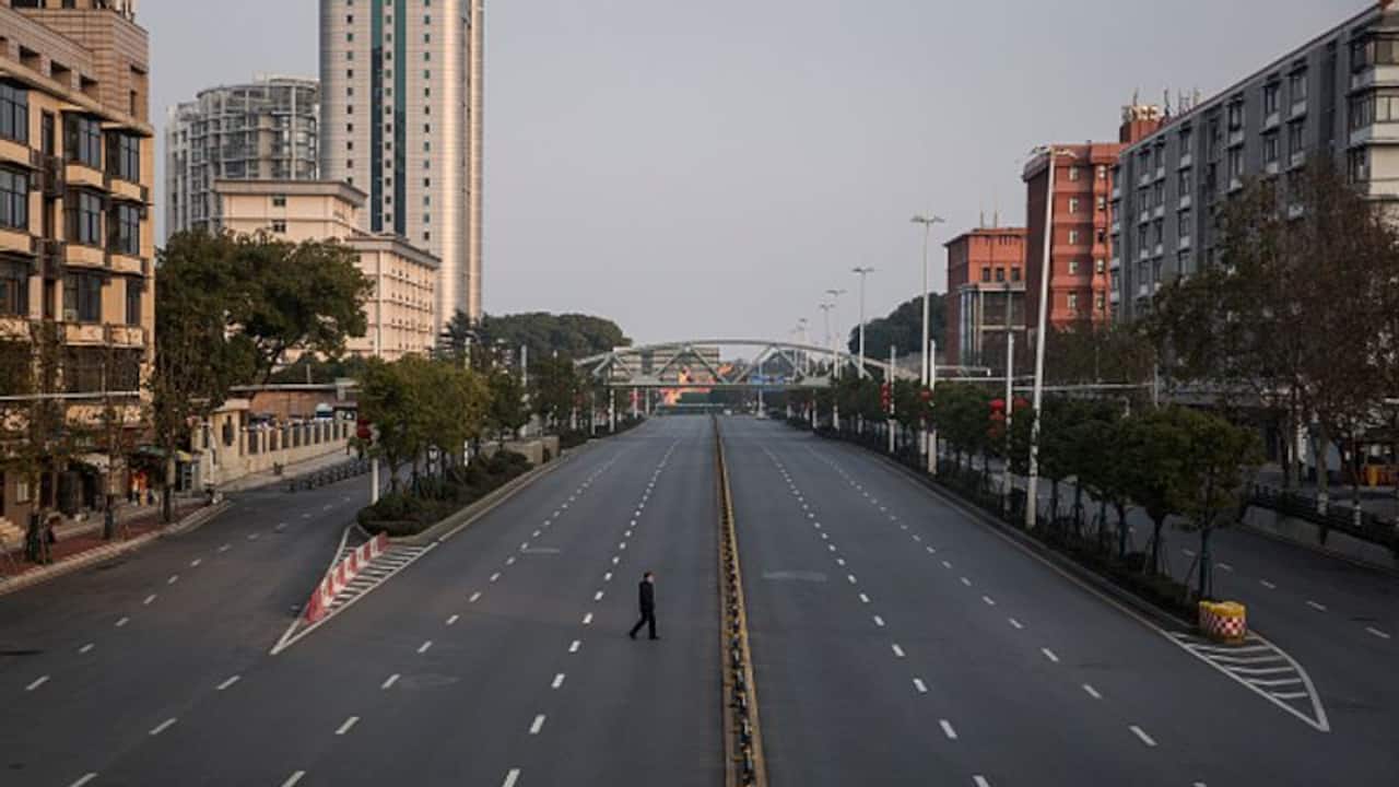 Line two metres apart: China officials warn residents over daily covid cases surge