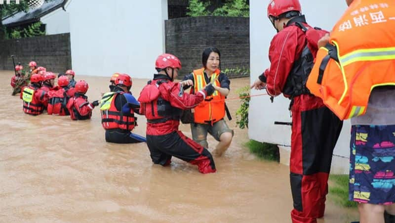 china flood 3 thousand people died china struggling  with rain