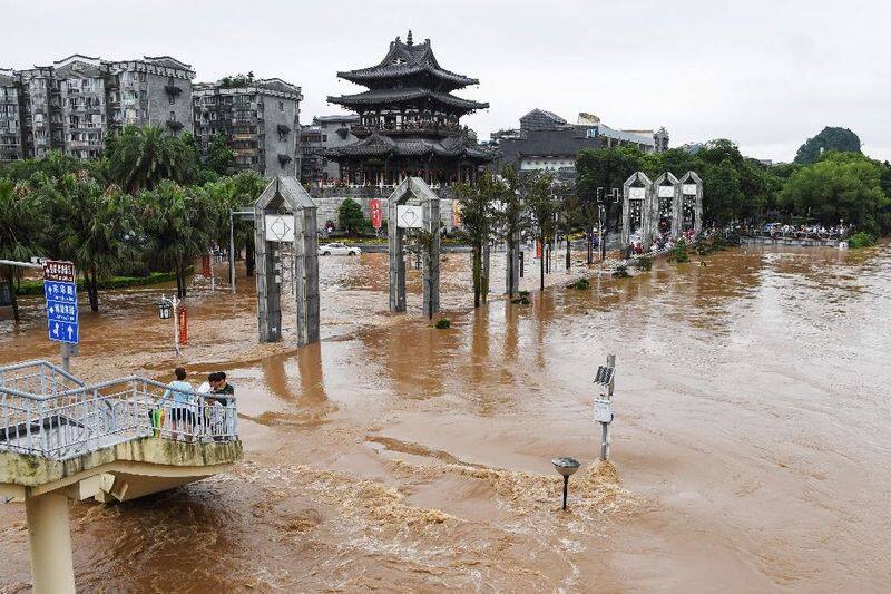 china flood 3 thousand people died china struggling  with rain