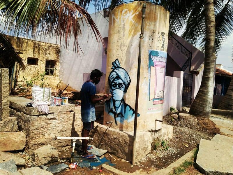 this artist doing street paintings on covid prevention