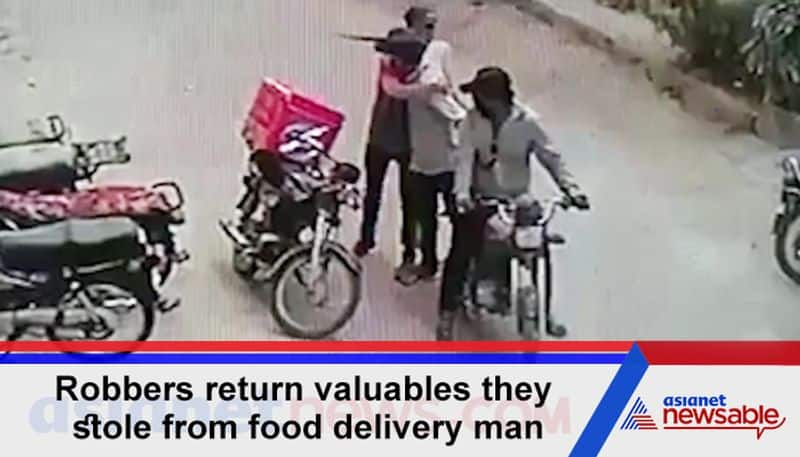 Watch Robbers return valuables they stole from food delivery man; hug him