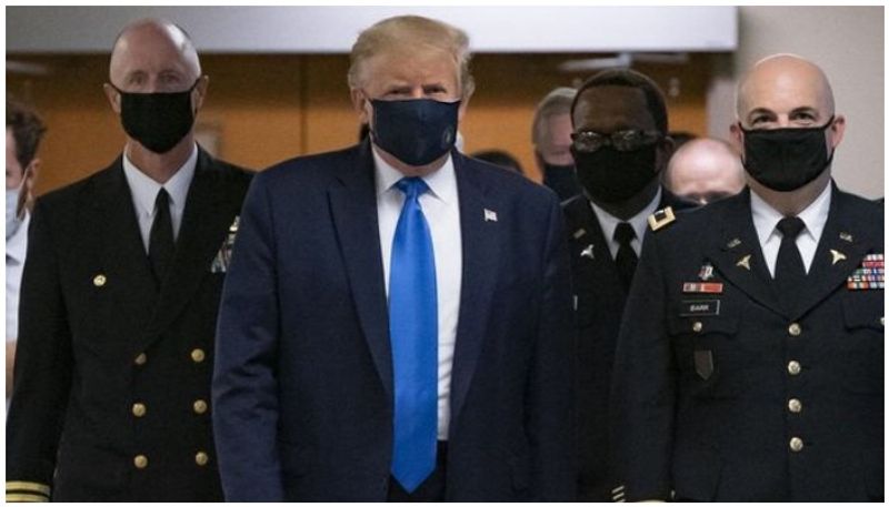 Donald Trump, who had declined to wear a mask in public, was spotted wearing one on Saturday