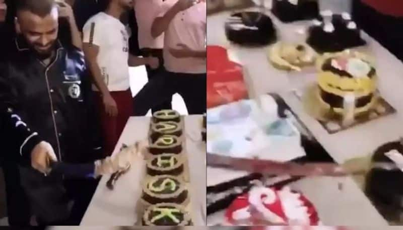 man cuts 25 birthday cakes with sword in mumbai