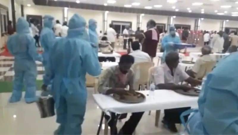 waiter wearing ppe kits socially distanced dinner in wedding