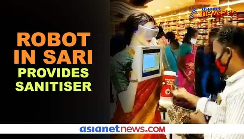 Watch Sari-clad robot mannequin provides sanitiser to customers