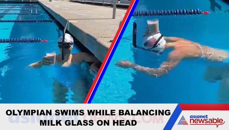 Olympic champion swims with glass of milk on head