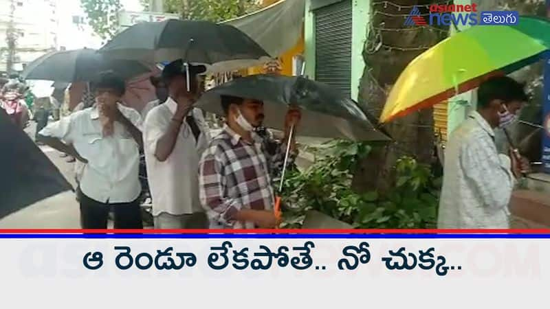 Social Distance with Umbrella at wine shops in Vijayawada