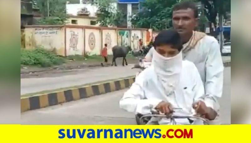 father takes his son on bicycle rides 105 km  to attend class 10 exam