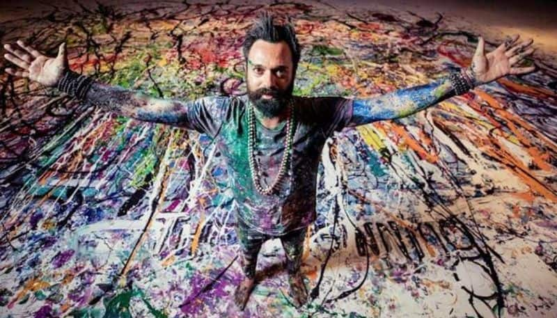 british artist sacha jafri working on 1980 square meter painting