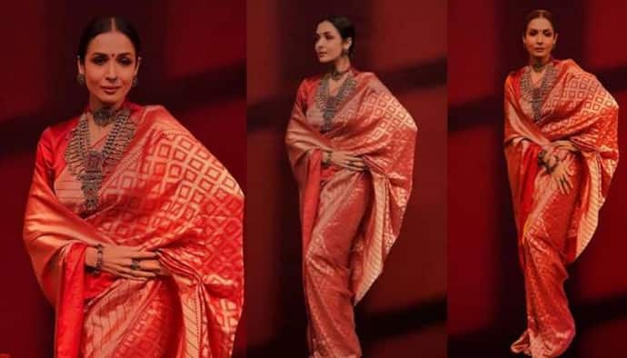 <p>റീ​ഗൽ റെഡ് നിറത്തിലുള്ള പട്ടുസാരിയുടുത്ത് നിൽക്കുന്ന മലൈകയുടെ ചിത്രങ്ങളാണ് ഇപ്പോള്‍ സോഷ്യല്‍ മീഡിയയില്‍ ശ്രദ്ധ നേടുന്നത്.&nbsp;ചുവപ്പിൽ ​ധാരാളം ​ഗോൾഡൻ വർക്കുകളടങ്ങിയ സാരിയില്‍&nbsp;സുന്ദരിയായിരിക്കുകയാണ് മലൈക.</p>
