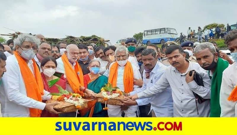 Minister Shivaram Hebbar Did Pooja to Dharma Dam in Hanagal in Haveri District