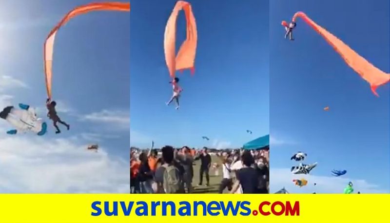 A 3 year old girl holding onto a kite was lofted high above a festival crowd video shows