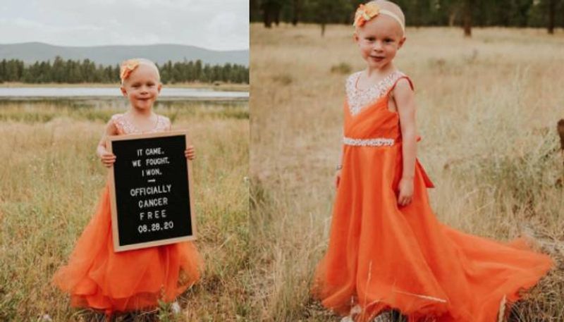 4 year old girl celebrates being cancer free