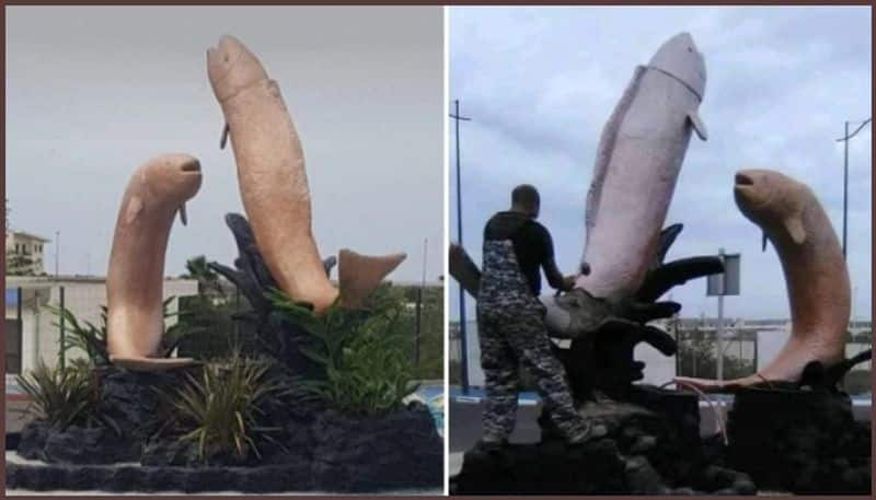 A statue of two fish leaping into the air on a roundabout in Mehdia, Morocco is being demolished.