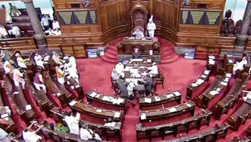 Opposition MPs demonstrate inside Parliament on the Adani issue.