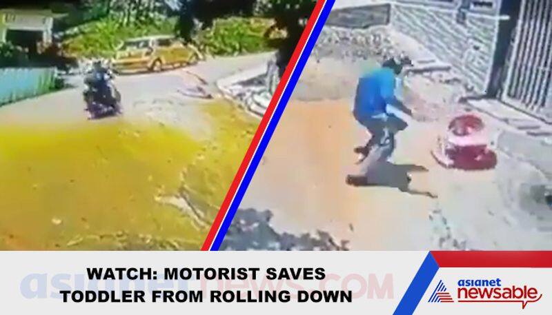 Man jumps off motorcycle, saves toddler rolling down a steep road; video goes viral - gps