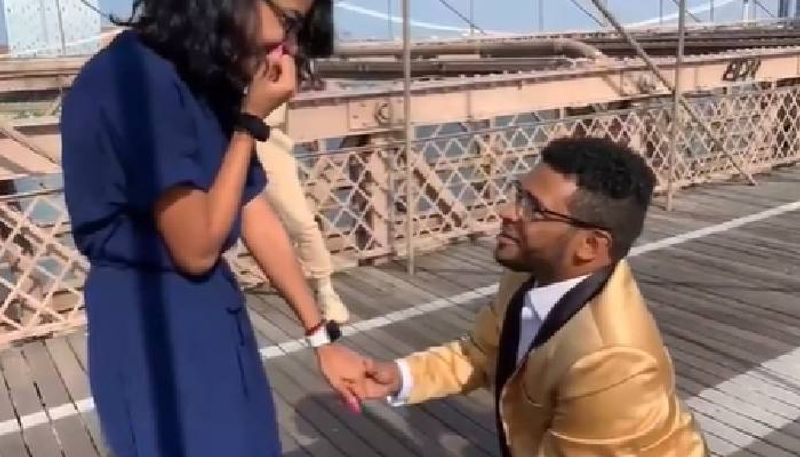 Cyclist rams into photographer capturing proposal on bridge