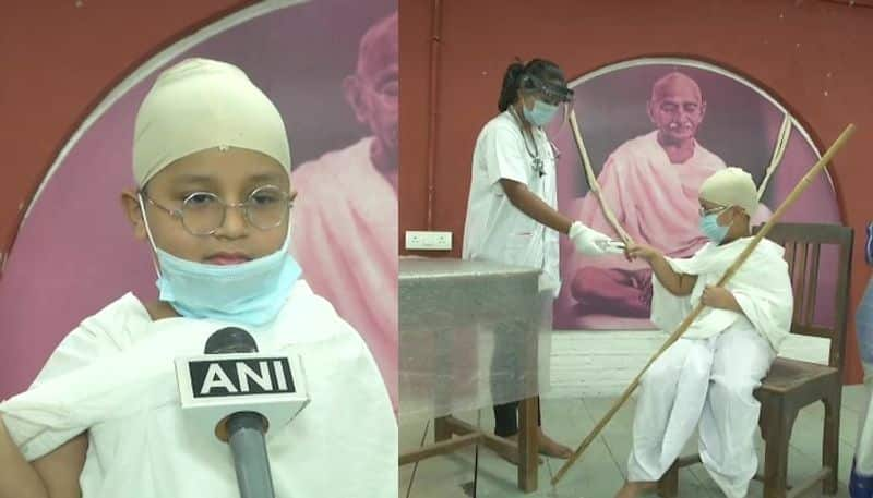 gujrat boy goes for covid 19 test dressed as gandhi