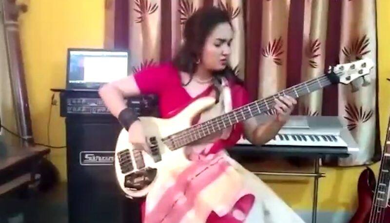 Sari-clad woman plays bass riff on progressive metal song Sea of Lies; video goes viral - gps