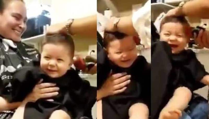 Viral video shows baby laughing while getting  haircut