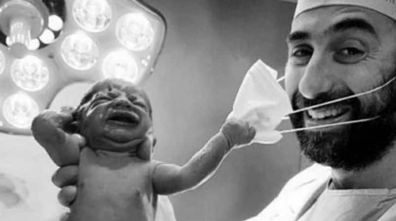 newborn removing Dubai doctors mask goes viral on social media