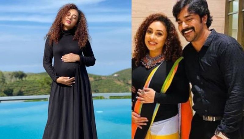 pearle maaney in black maternity dress