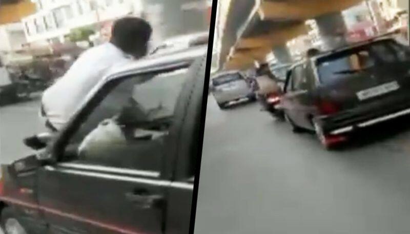 Man drags traffic police on car bonnet to evade fine; video goes viral - gps