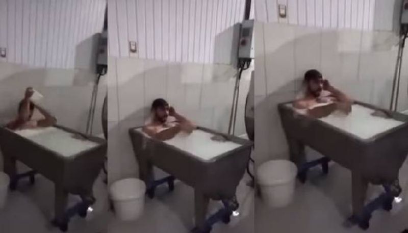 viral video of Dairy worker bathes in milk