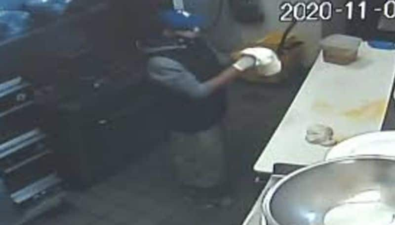 cctv footage in which burglar makes pizza at a restaurant