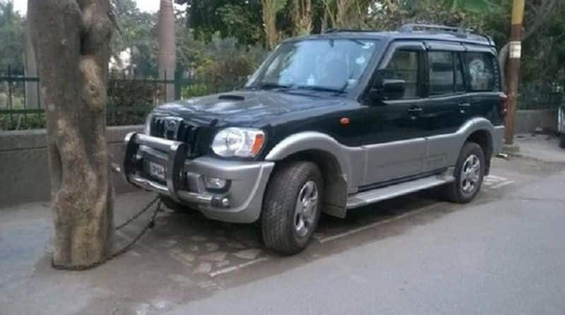 Scorpio car that tied up to a tree using chain Anand Mahindra tweet goes viral ckm