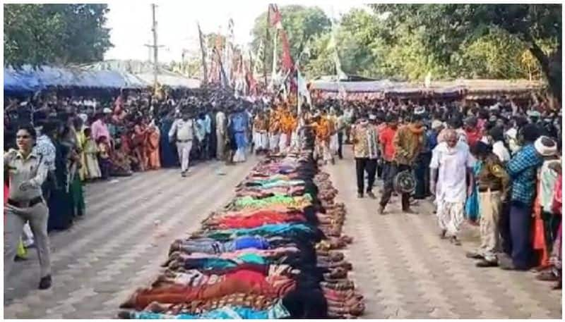 over 200 married women yearning to conceive lay on the ground and a group of priests walked on their backs