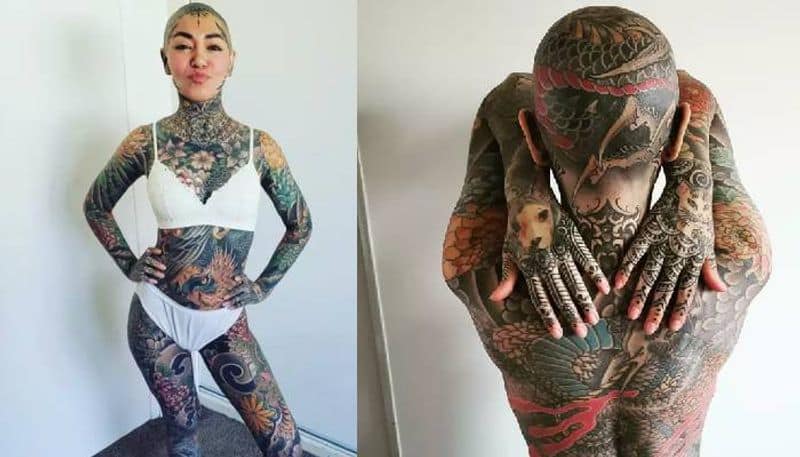 Woman tattooed head to toe