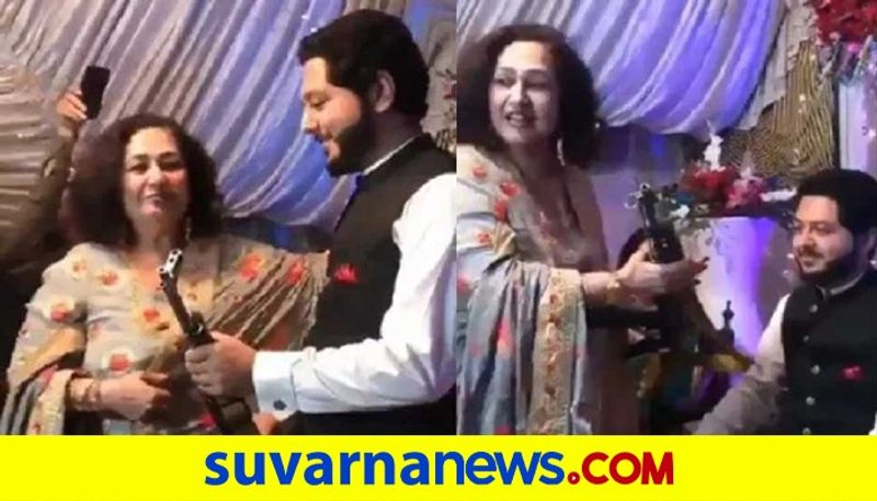 Pakistan Woman Gifts AK 47 to her son in law on his wedding pod