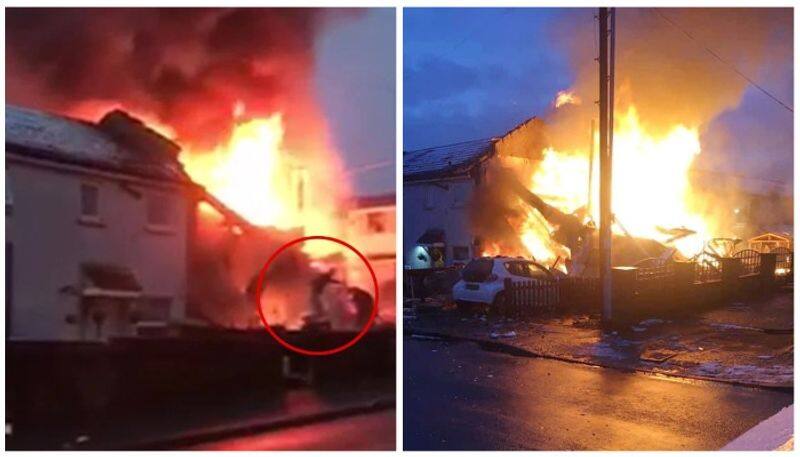 Dramatic moment dad and son leap from blazing home