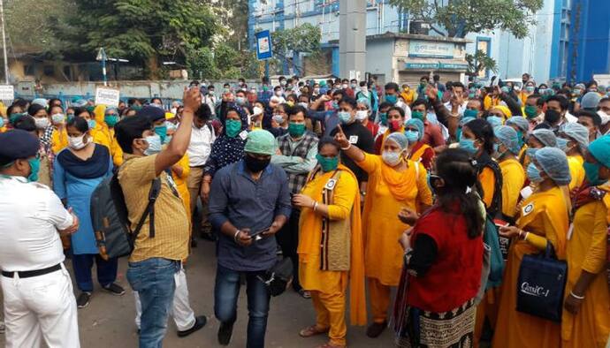 নামেই করোনা যোদ্ধা, নেই পর্যাপ্ত মাস্কু-পিপিই কিট, CMOH এর দফতরে বিক্ষোভ স্বাস্থ্যকর্মীদের