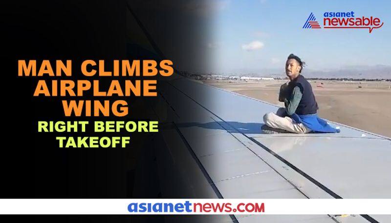 Man climbs airplane wing right before takeoff  - gps