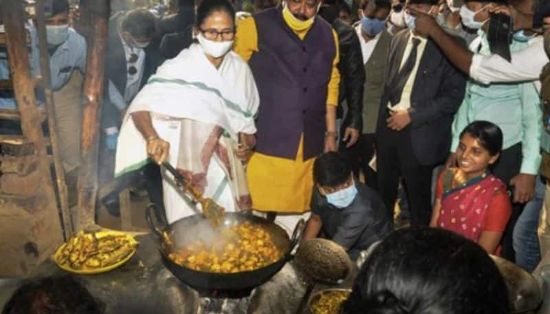 bengal chief minister mamata banerjee joints tribal women and cooked vegetable dish