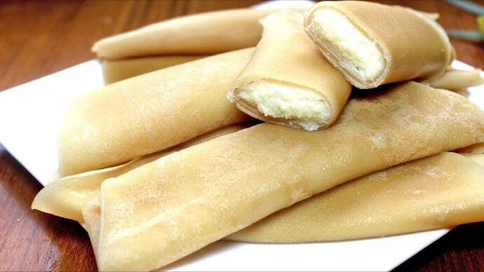 <p><strong>Patishapta – Bengal: </strong>There are two components to this stuffed dessert. First, the crispy crepe that is made with all-purpose flour, and second is the sweet and crumbly jaggery, coconut or khoya filling that wrapped inside the crepe. These are further sweetened with condensed milk. Try making it at home, you won't stop at one, we dare you!<br />
&nbsp;</p>
