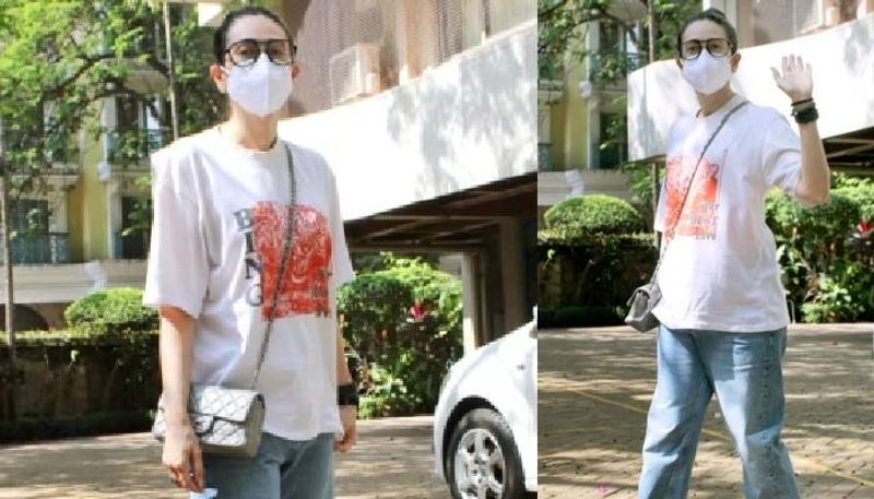 Karisma Kapoor in tshirt and denims with Rs 2.9 lakh bag